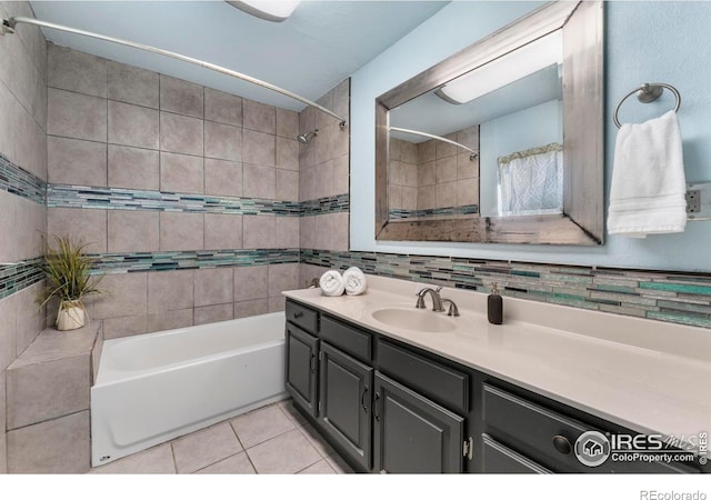 114 Berwick Ave, Firestone, CO 80520 - bathroom with vanity, tile patterned flooring, bathtub / shower combination, tile walls, and tasteful backsplash