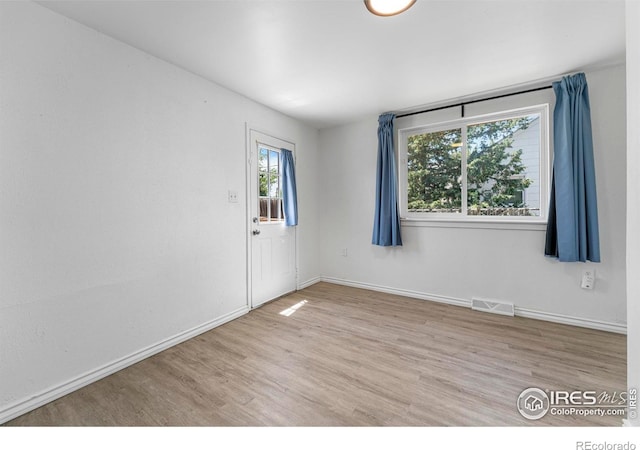 114 Berwick Ave, Firestone, CO 80520 - unfurnished room with light wood-style floors and baseboards