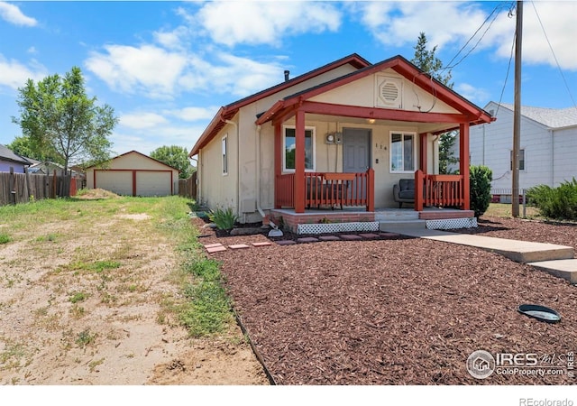 114 Berwick Ave, Firestone, CO 80520 - bungalow with a porch, an outdoor structure, and a garage