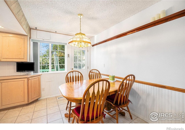 3066 W 134th Ct, Broomfield, CO 80020 - dining room with a chandelier, a textured ceiling, and light tile patterned floors