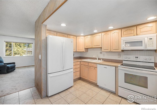 3066 W 134th Ct, Broomfield, CO 80020 - kitchen with white appliances, light brown cabinets, light colored carpet, recessed lighting, and light countertops