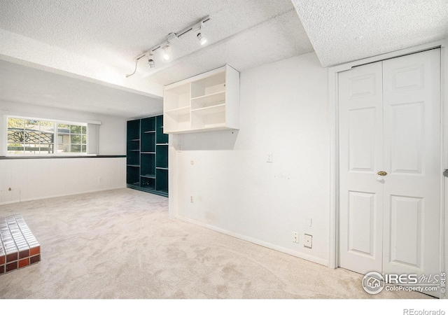 3066 W 134th Ct, Broomfield, CO 80020 - carpeted empty room featuring a textured ceiling and track lighting