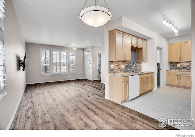 9266 W 107th Ln, Broomfield, CO 80021 - kitchen featuring light brown cabinets, dishwasher, tasteful backsplash, and light wood-type flooring