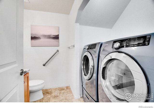 9266 W 107th Ln, Broomfield, CO 80021 - laundry room with washing machine and dryer and baseboards