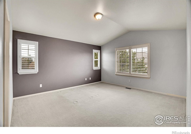 9266 W 107th Ln, Broomfield, CO 80021 - carpeted spare room featuring vaulted ceiling and baseboards