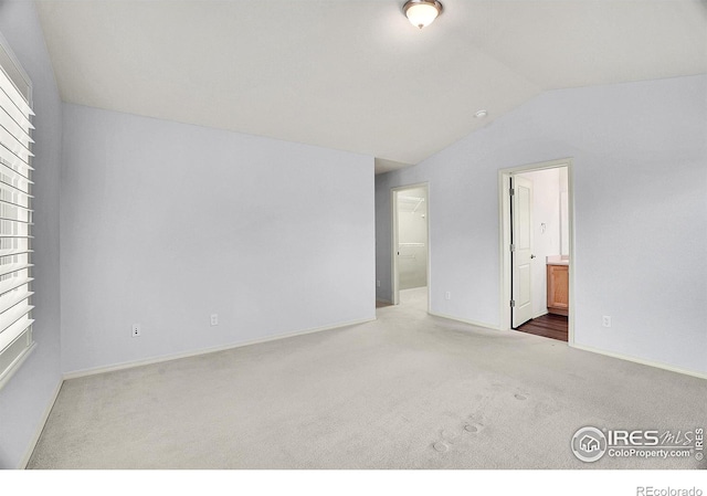 9266 W 107th Ln, Broomfield, CO 80021 - carpeted spare room featuring lofted ceiling and baseboards