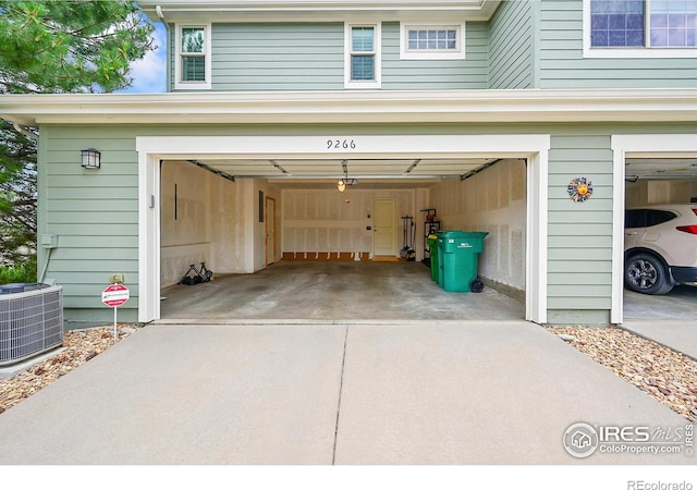 9266 W 107th Ln, Broomfield, CO 80021 - garage with concrete driveway and a garage door opener