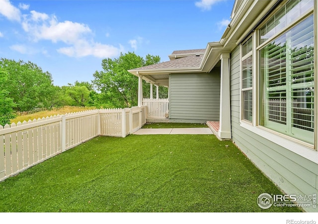 9266 W 107th Ln, Broomfield, CO 80021 - fenced backyard featuring a patio