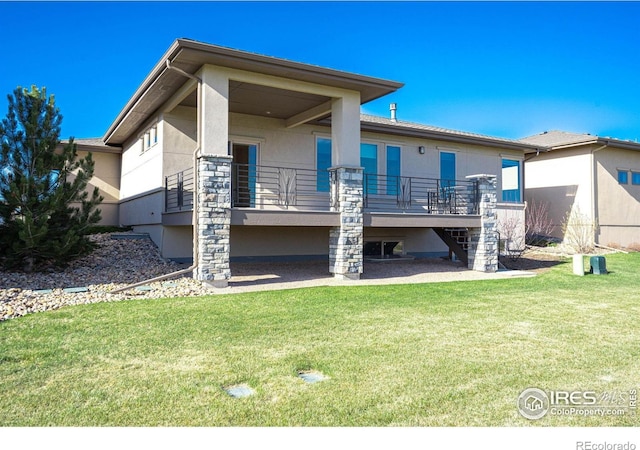 6928 Summerwind Ct, Timnath, CO 80547 - rear view of house featuring stairway, a lawn, and stucco siding