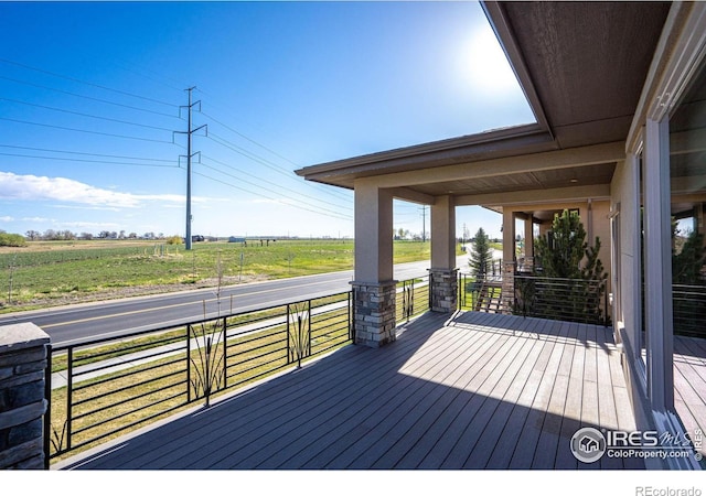 6928 Summerwind Ct, Timnath, CO 80547 - wooden terrace featuring a view of countryside