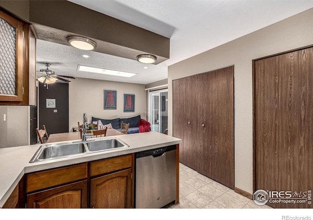 14 Douglas Dr N, Broomfield, CO 80020 - kitchen featuring stainless steel dishwasher, ceiling fan, light countertops, a peninsula, and open floor plan