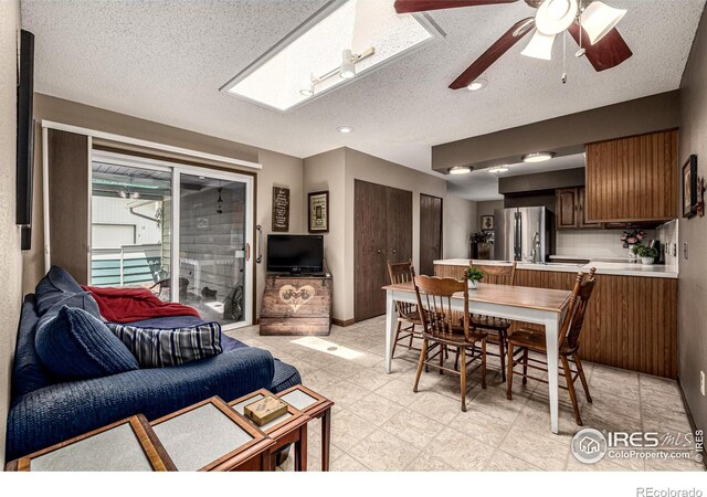 14 Douglas Dr N, Broomfield, CO 80020 - dining room with ceiling fan and a textured ceiling