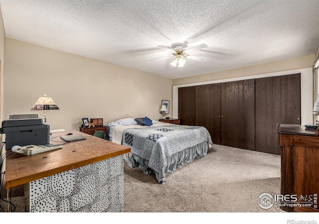 14 Douglas Dr N, Broomfield, CO 80020 - bedroom with light carpet, a desk, a closet, a textured ceiling, and ceiling fan