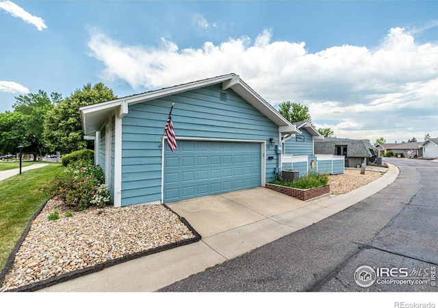 14 Douglas Dr N, Broomfield, CO 80020 - view of side of property featuring a garage and driveway