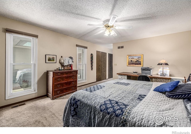 14 Douglas Dr N, Broomfield, CO 80020 - bedroom featuring carpet floors, ceiling fan, and a textured ceiling