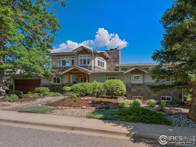 2695 Stanford Ave, Boulder, CO 80305 - view of front of home featuring stone siding and a chimney