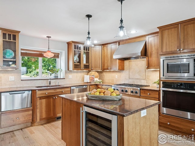 2695 Stanford Ave, Boulder, CO 80305 - kitchen featuring stainless steel appliances, beverage cooler, wall chimney range hood, dark stone counters, and brown cabinetry