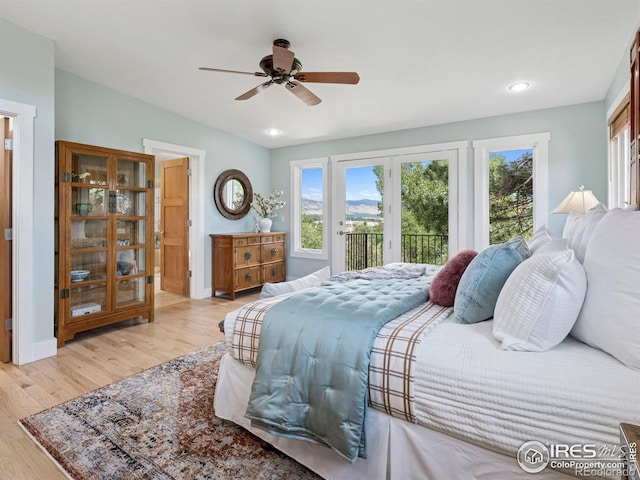 2695 Stanford Ave, Boulder, CO 80305 - bedroom with access to exterior, multiple windows, wood finished floors, and recessed lighting