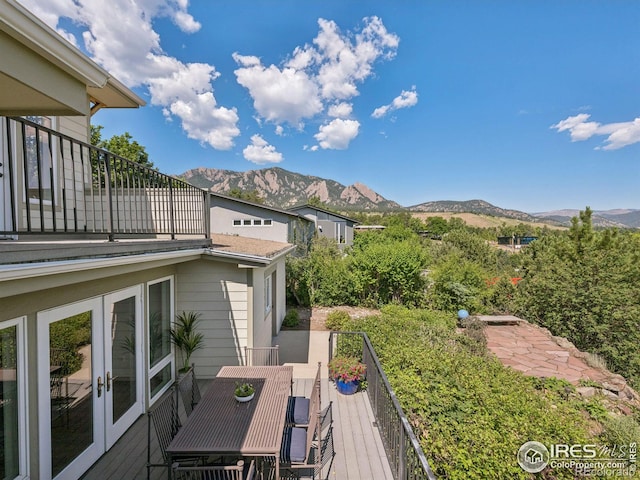 2695 Stanford Ave, Boulder, CO 80305 - wooden deck featuring a mountain view, french doors, and outdoor dining space