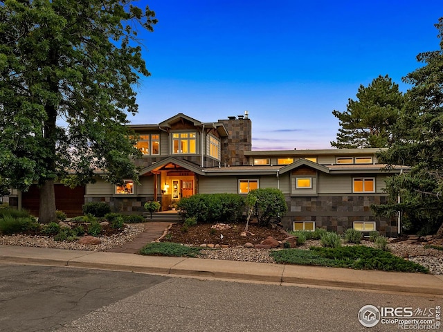 2695 Stanford Ave, Boulder, CO 80305 - view of front of house featuring stone siding and a chimney