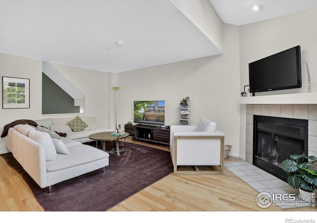 2954 Kalmia Ave # 34, Boulder, CO 80301 - living room featuring wood finished floors and a tiled fireplace