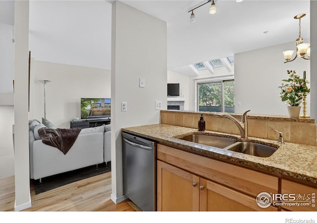 2954 Kalmia Ave # 34, Boulder, CO 80301 - kitchen with stainless steel dishwasher, open floor plan, light wood-style flooring, light stone countertops, and lofted ceiling