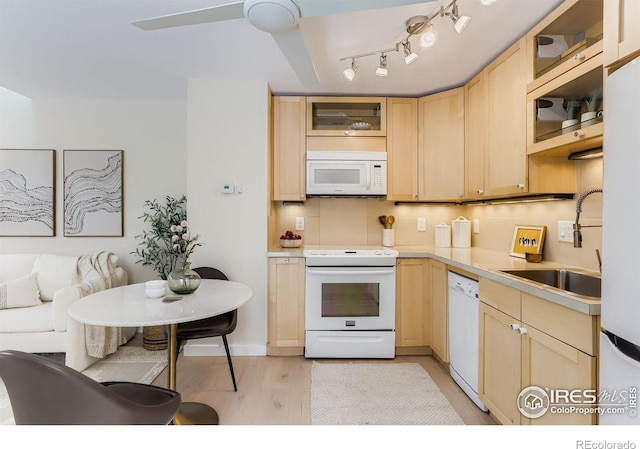 1825 Marine St Unit 8, Boulder, CO 80302 - kitchen with white appliances, light brown cabinetry, light wood-style floors, glass insert cabinets, and light countertops