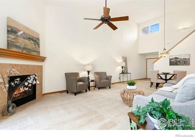 4603 Dusty Sage Ct Unit 4, Fort Collins, CO 80526 - carpeted living room with a high ceiling, a ceiling fan, and a tile fireplace