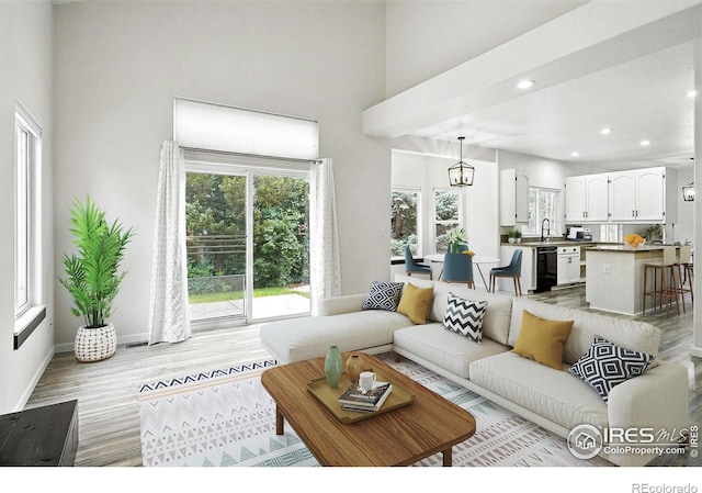 2078 Goldfinch Ct, Longmont, CO 80503 - living room with healthy amount of natural light, recessed lighting, light wood-type flooring, and a towering ceiling