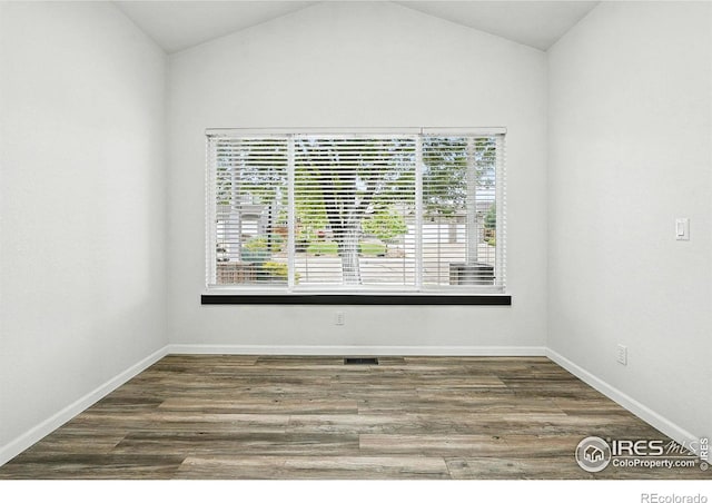 2078 Goldfinch Ct, Longmont, CO 80503 - empty room with wood finished floors and vaulted ceiling