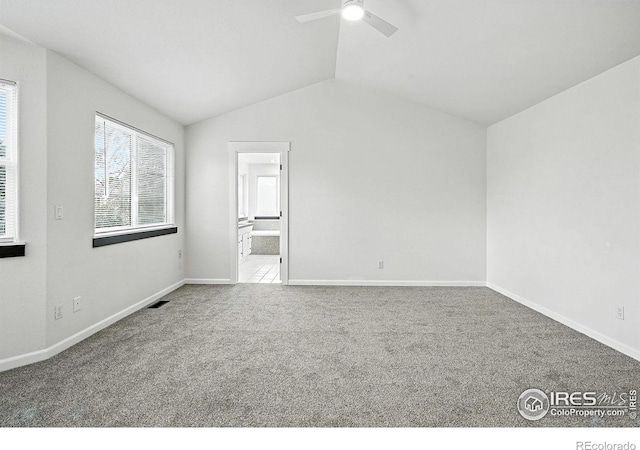 2078 Goldfinch Ct, Longmont, CO 80503 - empty room with a ceiling fan, carpet, and vaulted ceiling