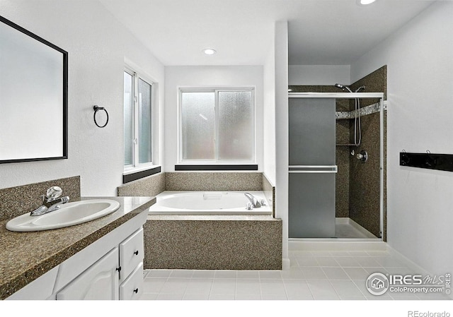 2078 Goldfinch Ct, Longmont, CO 80503 - bathroom featuring a shower stall, vanity, a bath, tile patterned flooring, and recessed lighting