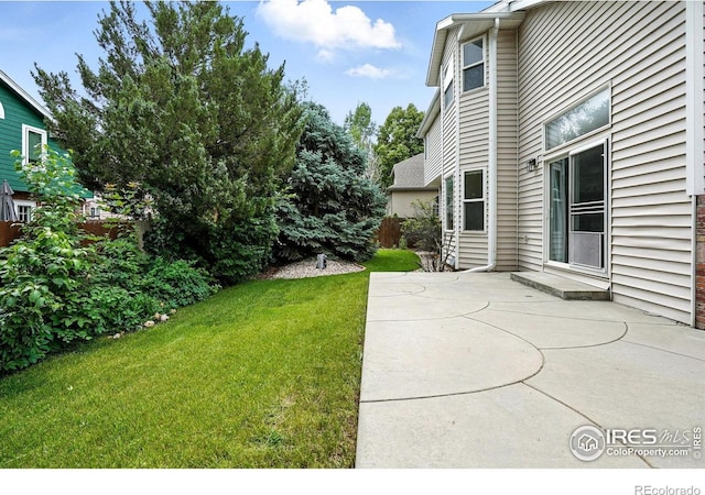 2078 Goldfinch Ct, Longmont, CO 80503 - view of grassy yard with a patio