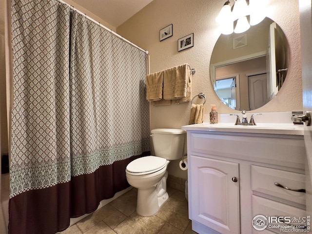 4101 Crittenton Ln Unit 102, Wellington, CO 80549 - bathroom with a textured wall, vanity, tile patterned floors, and a shower with shower curtain