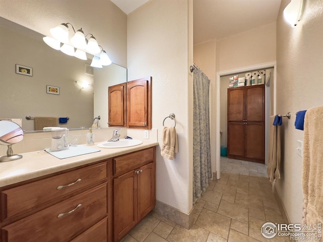 4101 Crittenton Ln Unit 102, Wellington, CO 80549 - bathroom with stone tile floors, vanity, and curtained shower