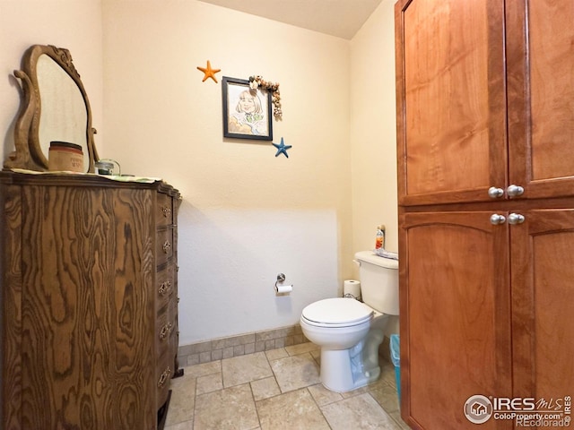4101 Crittenton Ln Unit 102, Wellington, CO 80549 - half bathroom with baseboards and stone tile flooring