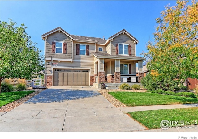 16021 Williams Pl, Broomfield, CO 80023 - craftsman house with driveway, covered porch, a garage, a front yard, and stone siding