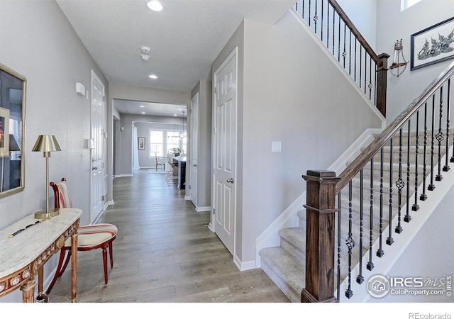 16021 Williams Pl, Broomfield, CO 80023 - corridor with wood finished floors, stairs, and recessed lighting