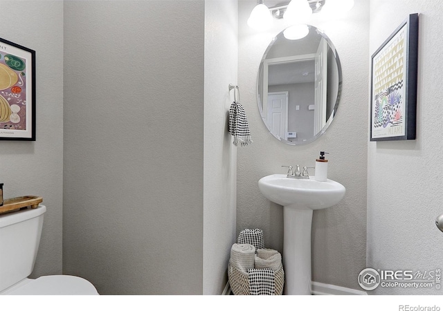 16021 Williams Pl, Broomfield, CO 80023 - half bathroom featuring toilet and a sink