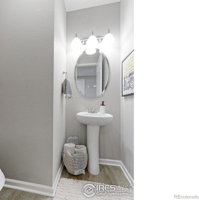 16021 Williams Pl, Broomfield, CO 80023 - half bath with wood finished floors and baseboards