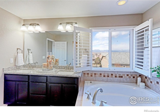 16021 Williams Pl, Broomfield, CO 80023 - bathroom featuring double vanity, a bath, and plenty of natural light