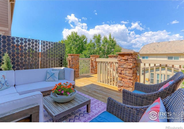 16021 Williams Pl, Broomfield, CO 80023 - wooden deck with an outdoor hangout area