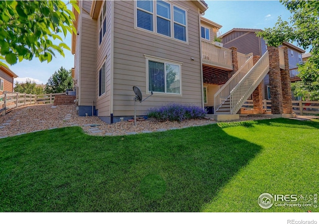 16021 Williams Pl, Broomfield, CO 80023 - back of property with stairs and a wooden deck