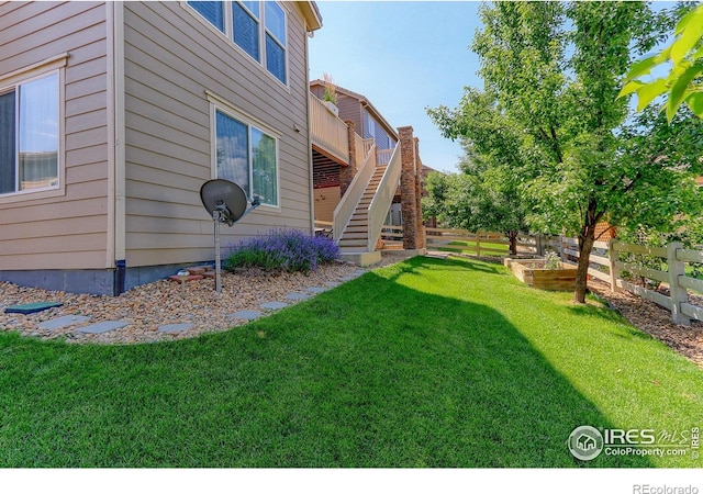 16021 Williams Pl, Broomfield, CO 80023 - view of yard with stairway, a deck, and a garden