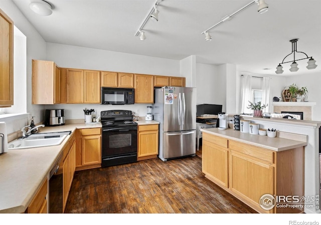 14700 E 104th Ave Unit 2605, Commerce City, CO 80022 - kitchen featuring black appliances, track lighting, dark wood-style floors, and light countertops