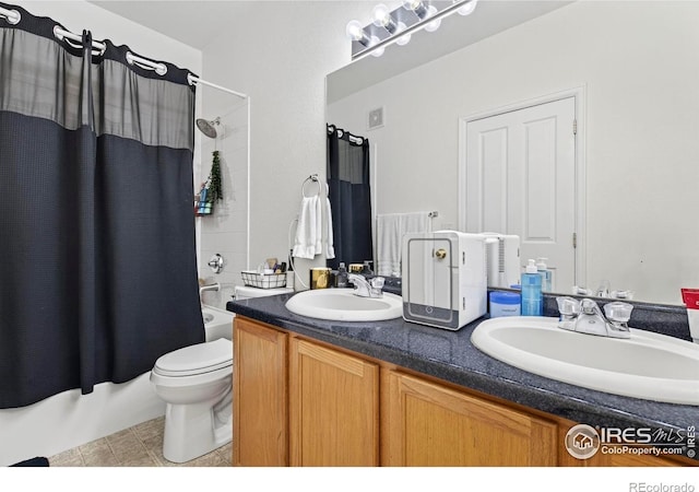 14700 E 104th Ave Unit 2605, Commerce City, CO 80022 - full bathroom with double vanity, shower / bath combo with shower curtain, and tile patterned floors