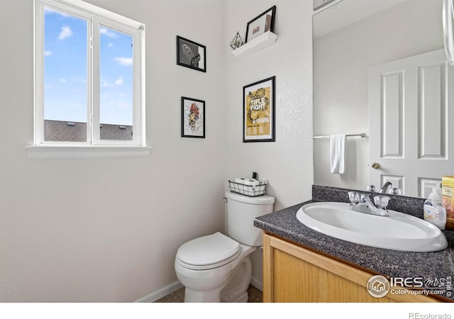 14700 E 104th Ave Unit 2605, Commerce City, CO 80022 - bathroom featuring baseboards and vanity