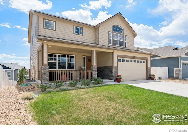 1325 Tipton St, Berthoud, CO 80513 - view of front facade featuring stone siding, covered porch, a garage, and driveway