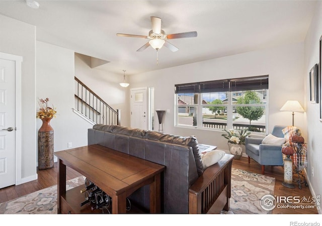 1325 Tipton St, Berthoud, CO 80513 - living area featuring stairway, ceiling fan, and wood finished floors