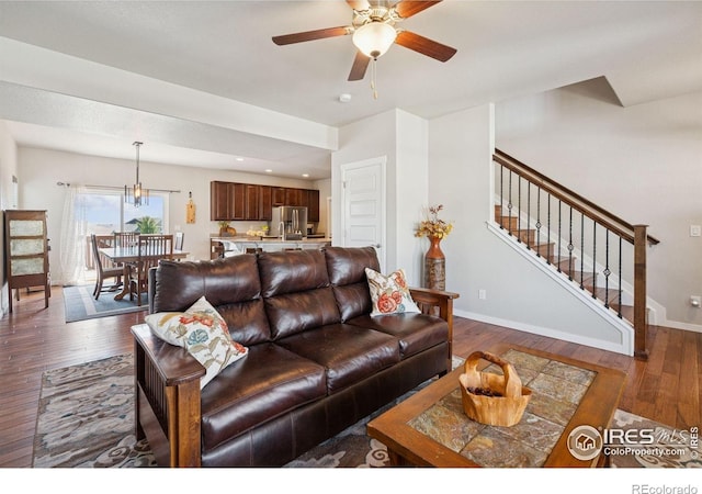 1325 Tipton St, Berthoud, CO 80513 - living room with dark wood finished floors, stairway, ceiling fan, and recessed lighting